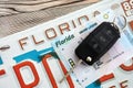 Remote control car keys on Florida license plate with driver license. Car driving in Florida Royalty Free Stock Photo