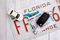 Remote control car keys on Florida license plate with driver license. Car driving in Florida Royalty Free Stock Photo