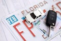 Remote control car keys on Florida license plate with driver license. Car driving in Florida Royalty Free Stock Photo
