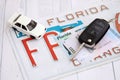 Remote control car keys on Florida license plate with driver license. Car driving in Florida Royalty Free Stock Photo