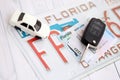 Remote control car keys on Florida license plate with driver license. Car driving in Florida Royalty Free Stock Photo