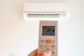 remote control command for air conditioning to be handled point to the device with the order to 20Â°C Royalty Free Stock Photo