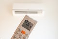 remote control command for air conditioning to be handled point to the device with the order to 20Â°C Royalty Free Stock Photo