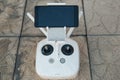 Remote control drone close up with phone