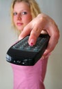 Remote Control in girl's hand Royalty Free Stock Photo