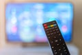 Remote control interacting with smart television Royalty Free Stock Photo
