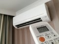 Remote control pointing at air conditioner Royalty Free Stock Photo