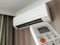 Remote control pointing at air conditioner Royalty Free Stock Photo