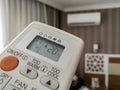 Remote control pointing at air conditioner Royalty Free Stock Photo