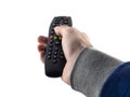 Remote control TV in a man`s hand Royalty Free Stock Photo