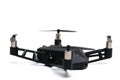 A remote controlled flying drone with four propeller rotors and spy camera on board