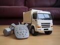 Remote-controlled Toy Garbage Truck That Is Off-white Or Beige In Color