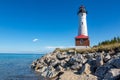 Remote Crisp Point Lighthouse on the rocky shores of Lake Superior, USA Royalty Free Stock Photo