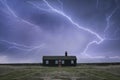 Remote desolate isolated house under dark stormy sky during Winter landscape conceptual image Royalty Free Stock Photo