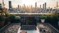 Remote developer coding on a laptop outdoors with string lights and a stunning city skyline view Royalty Free Stock Photo