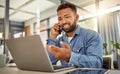 Remote entrepreneur working from home on his laptop. Virtual businessman making a phone call on his cellphone. Confident Royalty Free Stock Photo