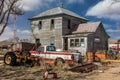 Remote falling down house and junk yard surrounding it, Nebraska Royalty Free Stock Photo