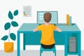 Remote home-based online training. A schoolboy with a computer sits at a table in his house and listens to a school