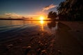 remote island beach with crystal-clear waters and majestic tropical sunset