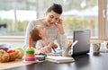 Happy mother with baby working at home office Royalty Free Stock Photo