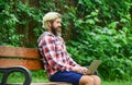 Remote job. Online shopping. Agile business. Bearded guy sit bench park nature background. Work and relax. Working