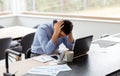 Stressed man with laptop working at home office Royalty Free Stock Photo