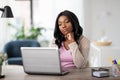 Bored woman with laptop working at home office Royalty Free Stock Photo