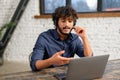 Remote job, technology and people concept. Happy smiling man with headset and laptop computer having video conference at Royalty Free Stock Photo