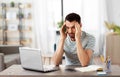 Stressed man with laptop working at home office Royalty Free Stock Photo