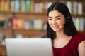 Remote Jobs. Asian girl call center operator with headset and laptop, closeup Royalty Free Stock Photo