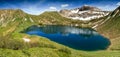 Remote lake up high in the alpine mountains. Schrecksee. Royalty Free Stock Photo