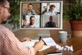 Remote meeting. Man working from home during coronavirus or COVID-19 quarantine, remote office concept. Royalty Free Stock Photo