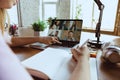 Remote meeting. Woman working from home during coronavirus or COVID-19 quarantine, remote office concept. Royalty Free Stock Photo