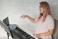 Remote music lessons. A singing teacher records the lesson on a laptop webcam. Royalty Free Stock Photo