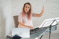 Remote music lessons. A singing teacher records the lesson on a laptop webcam. Royalty Free Stock Photo