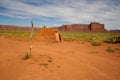 Remote Navajo Hogan Beside Old Deadwood Treestump in Monument Valley, Arizona Royalty Free Stock Photo