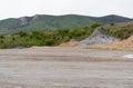 Remote photo of muddy volcanoes in Buzau, Romania, showing gray lava and cracked volcanic soil Royalty Free Stock Photo