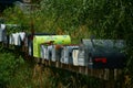 Rows of Mail Boxes sits becide a Mountian Pass Road Royalty Free Stock Photo