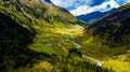 Remote Settlement With Farm Houses In Valley With Mountain River In Deferegental In Tirol In Austria Royalty Free Stock Photo