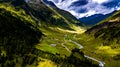 Remote Settlement With Farm Houses In Valley With Mountain River In Deferegental In Tirol In Austria Royalty Free Stock Photo