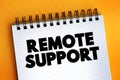 Remote Support text on notepad, concept background Royalty Free Stock Photo