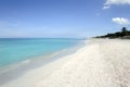 Remote tropical beach with fine white sand, clear turquoise blue water and few tourists in Varadero, Cuba Royalty Free Stock Photo