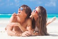 Close up of young beautiful couple laughing at beach