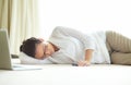 Remote work, burnout and tired woman sleeping on a floor with low energy, exhausted or nap after laptop project Royalty Free Stock Photo