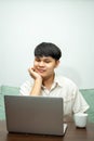 Remote work concept, Male freelancer thinking about business project and working on laptop at home Royalty Free Stock Photo