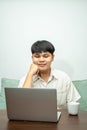 Remote work concept, Male freelancer thinking about business project and working on laptop at home