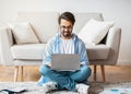 Remote Work Concept. Smiling Arab Freelancer Guy Using Laptop Computer At Home Royalty Free Stock Photo