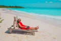 Remote work concept -young woman with laptop on beach Royalty Free Stock Photo