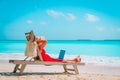 Remote work concept -young woman with laptop on beach Royalty Free Stock Photo