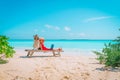 Remote work concept -young woman with laptop on beach Royalty Free Stock Photo